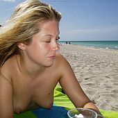Topless posing relaxing beach.