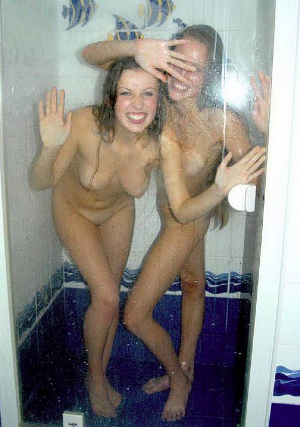 Two Longhair Naked Girlfriends Posing And Teasing In The Shower